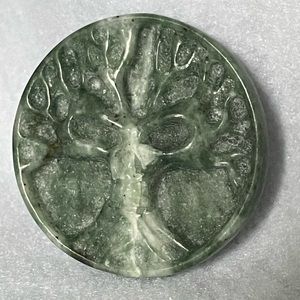 Carved skull tree of life jade coin